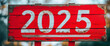 © Anna - number 2025 written on red wooden signboard