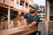 © standret - Showing thumb up. Foreman is in the storehouse, shipping distribution business