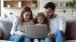 © Ariep - Happy Family Using Laptop Together on the Couch