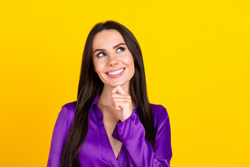 Wall Mural - Photo of positive smiling lady touch chin look empty space thinking isolated bright color background