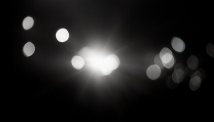 abstract white lens flare on black background, bokeh defocused lights and shadow overlay for photography