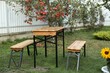© New Africa - Wooden table with benches in apple garden