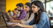 © ramona - A group of Indian women and men sitting in front of laptops
