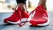 © Nicholas - Red Running Shoes on Track