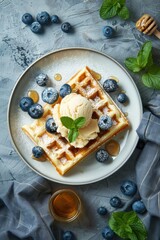 Blueberry waffle in plate with honey on table