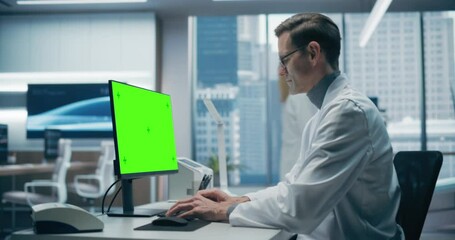 Aufkleber - Male Scientist in a White Lab Coat Works on a Green Screen Computer in a Modern Medical Lab, Focusing on Research and Healthcare Analysis in a High-tech Hospital Environment.