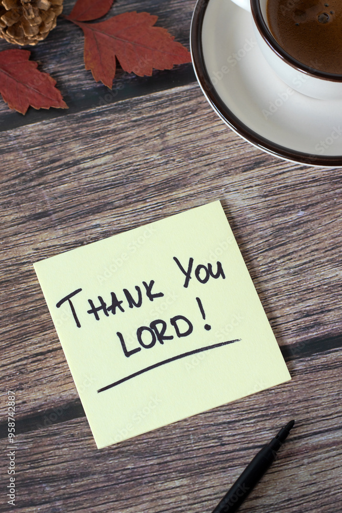 Thank You LORD, handwritten note on wooden table with coffee cup and ...