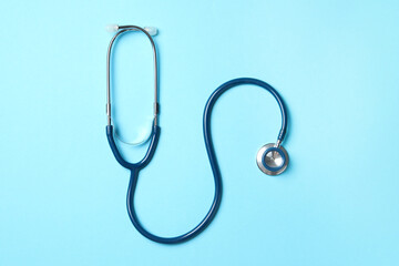 Wall Mural - Stethoscope on light blue background, top view. Medical treatment