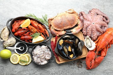 Canvas Print - Many different sea food on grey table, top view