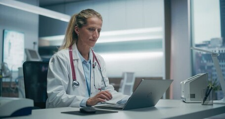 Aufkleber - Expert Female Physician Works on a Laptop in a Hospital Office, Focusing on Patient Data Analysis and Medical Research in an Advanced Clinical Setting. Static Medicum Shot