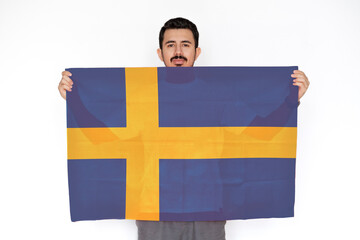 Young man holding Sweden flag, independence day idea, protest or social issues in Sweden, two hands 