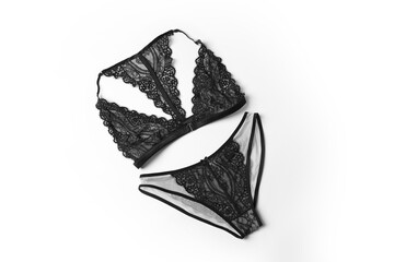 Wall Mural - Elegant black lace women's underwear on white background, top view