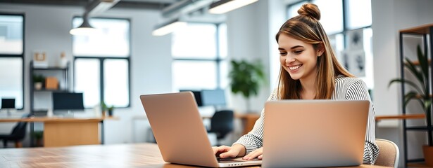 Sticker - Smiling Woman Working on Laptop in Modern Office