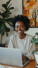 Wall Mural - Cheerful individual working from home office surrounded by lush green plants and vibrant wall art, embodying modern remote work lifestyle.