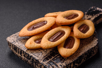 Delicious sweet crispy cookies with chocolate filling in the center