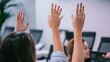 © Felippe Lopes - People raising hands in a classroom setting, eager to participate and engage.