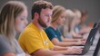© Khritthithat - Coding Bootcamp Session: Instructor-led coding session with students working on laptops