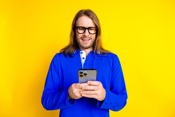 Wall Mural - Photo of confused handsome man wear stylish blue clothes send letter isolated on yellow color background