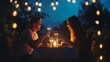 © Felippe Lopes - A couple enjoys a romantic dinner under the stars, toasting with glasses of wine.