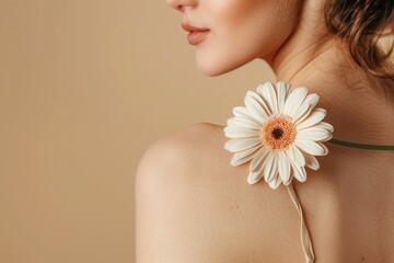 Sticker - A close up of a woman with a delicate flower attached to her shoulder, showcasing natural beauty against a soft beige background