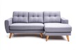 © Premreuthai - Modern gray sofa with tufted upholstery and wooden legs, perfect for a stylish living room or lounge area.