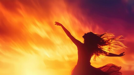 A silhouette of a dancer celebrating freedom against a stunning sunset backdrop, capturing the essence of joy and movement.