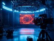 © Pornarun - A professional film studio set with a camera and red and blue lights, ready for filming.