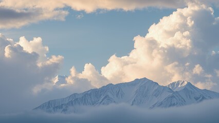 Sticker - Fluffy clouds loom over snow-capped mountains.