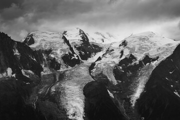 Wall Mural - Panorama of alps. Extreme sports in mountains. High resolution photo. Ski, parasailing, climbing, alpinism.