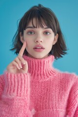 Canvas Print - A person wearing a pink turtle neck sweater