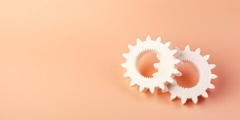 Three white gears on a Peach background, laid flat, copy space concept for business technology and development in the abstract vector with copy space 