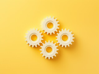 Wall Mural - Three white gears on a Yellow background, laid flat, copy space concept for business technology and development in the abstract vector with copy space 