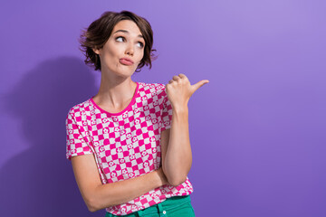 Wall Mural - Photo portrait of lovely young lady point look skeptical empty space dressed stylish pink garment isolated on violet color background