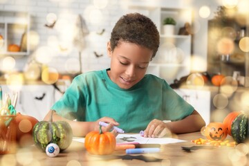 Poster - African-American boy drawing Halloween picture at table