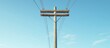 ©  AugmentArt - High voltage power pole against a backdrop of a clear blue sky