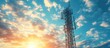 ©  AugmentArt - Mobile phone base station tower showcasing the advancement of communication systems in an urban environment framed by a sunrise and a backdrop of blue skies with clouds