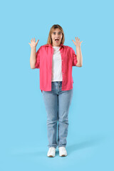 Sticker - Shocked young woman on blue background