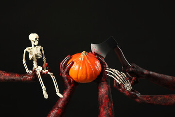 Wall Mural - Many hands of zombies with fresh pumpkin, axe and skeleton on black background. Halloween celebration