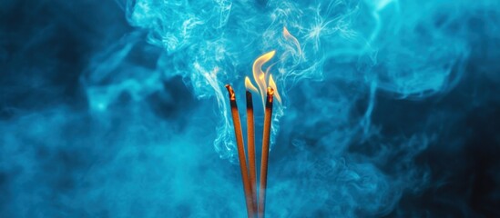 Burning Incense Sticks with Blue Smoke