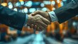 © Asayamrad - Blurry industrial port background with a close-up of a handshake in the foreground, symbolizing business agreements and collaboration..