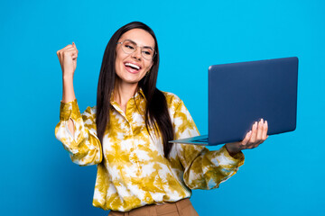 Canvas Print - Photo of glad happy lovely woman wear trendy clothes hold gadget watch video fan support isolated on blue color background