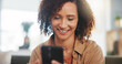 © WesLens/peopleimages.com - Sofa, happy woman and connection with cellphone for chat, conversation and message with contact. Home, female person and laughing with mobile app for dating website, profile match and online partner