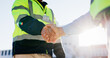 © peopleimages.com - Business people, civil engineer or handshake with colleague for building, teamwork or partnership in city. Closeup, contractor or architect shaking hands for b2b, architecture or deal on construction