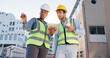 © WesLens/peopleimages.com - Tablet, blueprint and construction engineers on rooftop site for city planning, renovation or building project. Digital technology, architecture and industrial civil employees with maintenance check.