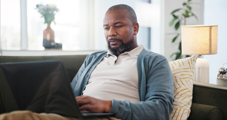 Canvas Print - Laptop, relax and black man on sofa in home for research on holiday planning with flight ticket. Computer, living room and African male person reading online review for hotel booking with travel.