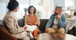 © WesLens/peopleimages.com - Couple, therapy and conversation with notes on sofa for marriage counseling, communication or support. Consulting, service and therapist with book for marital issues, advice and conflict resolution