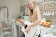 © ultramansk - A musician woman plays an acoustic guitar in a bright kitchen, combining the themes of domestic life and artistic expression, reflecting a relaxed lifestyle focused on creativity and comfort.