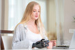 © ultramansk - A young woman is using a robotic prosthetic arm hand attached to her body to work on a desk. she is doing computer document and communication work. woman tries to control the smart arm in her home.