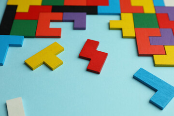 Sticker - Colorful wooden puzzle pieces on light blue background