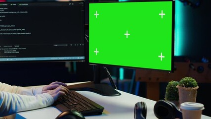 Cybersecurity expert uses green screen computer to look for security vulnerabilities and injected malware, close up. Admin installing fortified code on chroma key PC to prevent cyber attacks, camera A